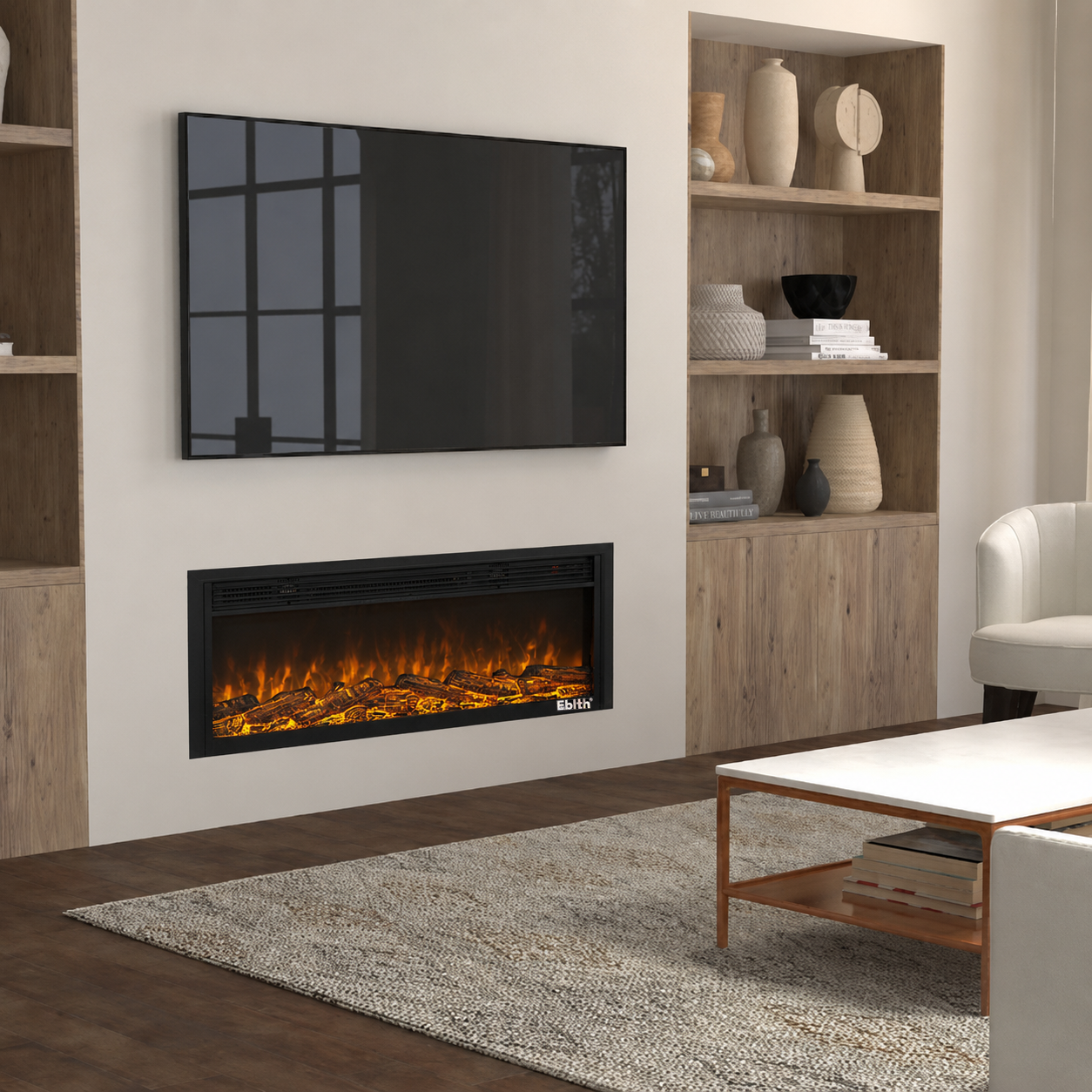 A modern wall-mounted electric fireplace with glowing orange flames and dark logs, installed below a flat-screen TV in a beige wall. The Electric fireplace has a slim black frame and a small white brand badge at the bottom right.